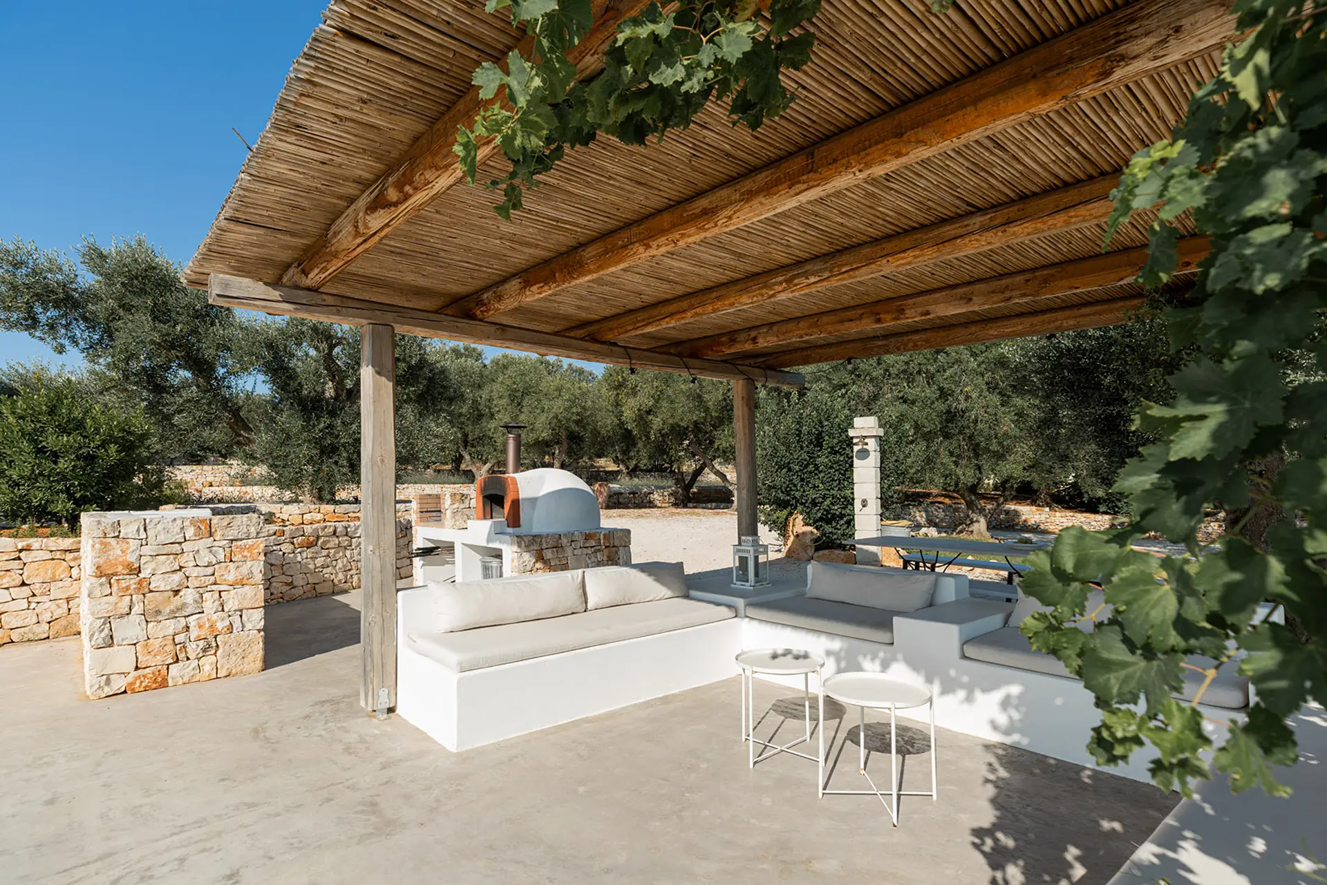 74_Villa_Margareta_Puglia_Paradise_luxury_seafront_swimming_pool_veranda_ulive_trees_shadow_sofa
